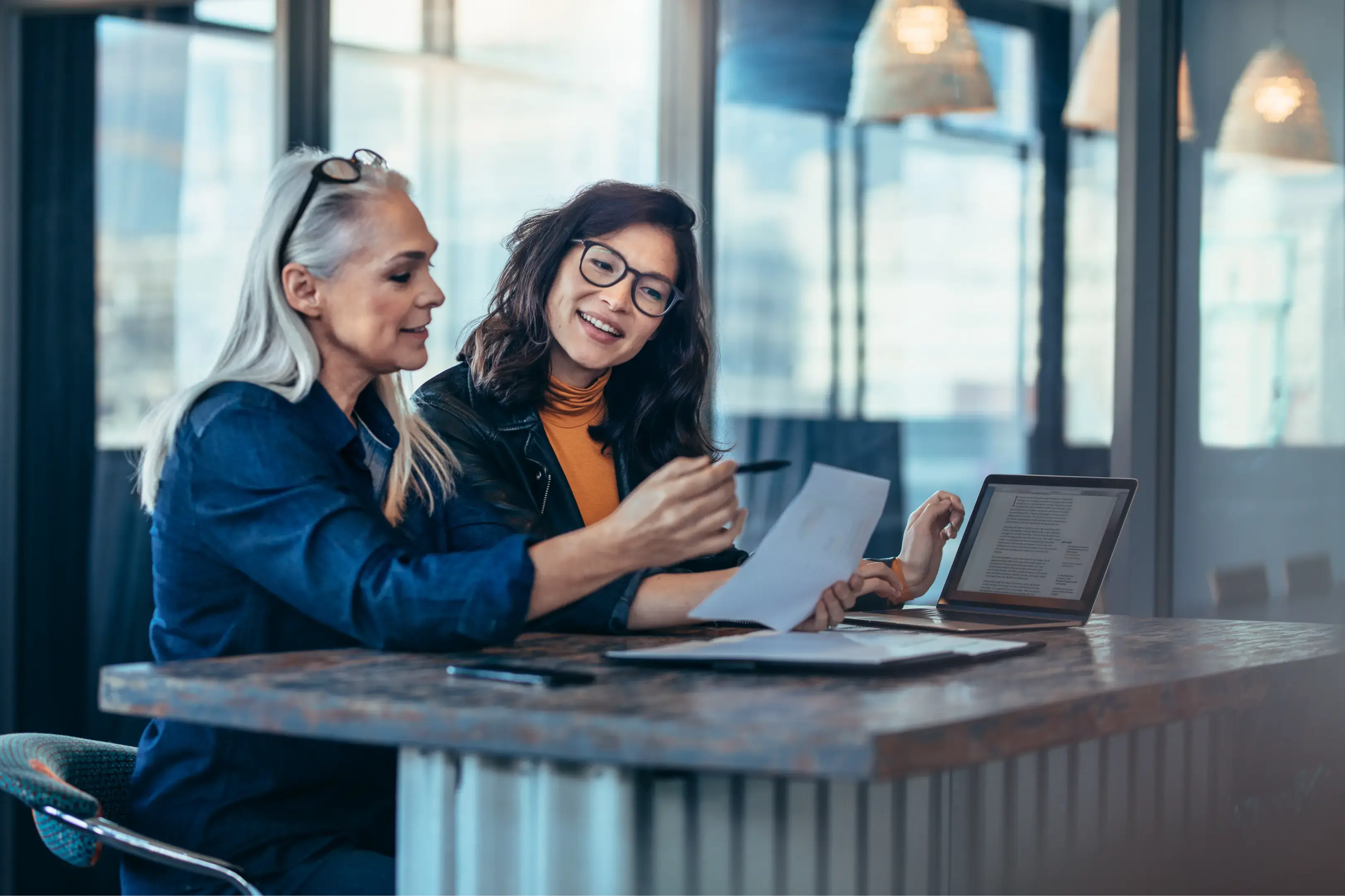 Women working on their devices in an office