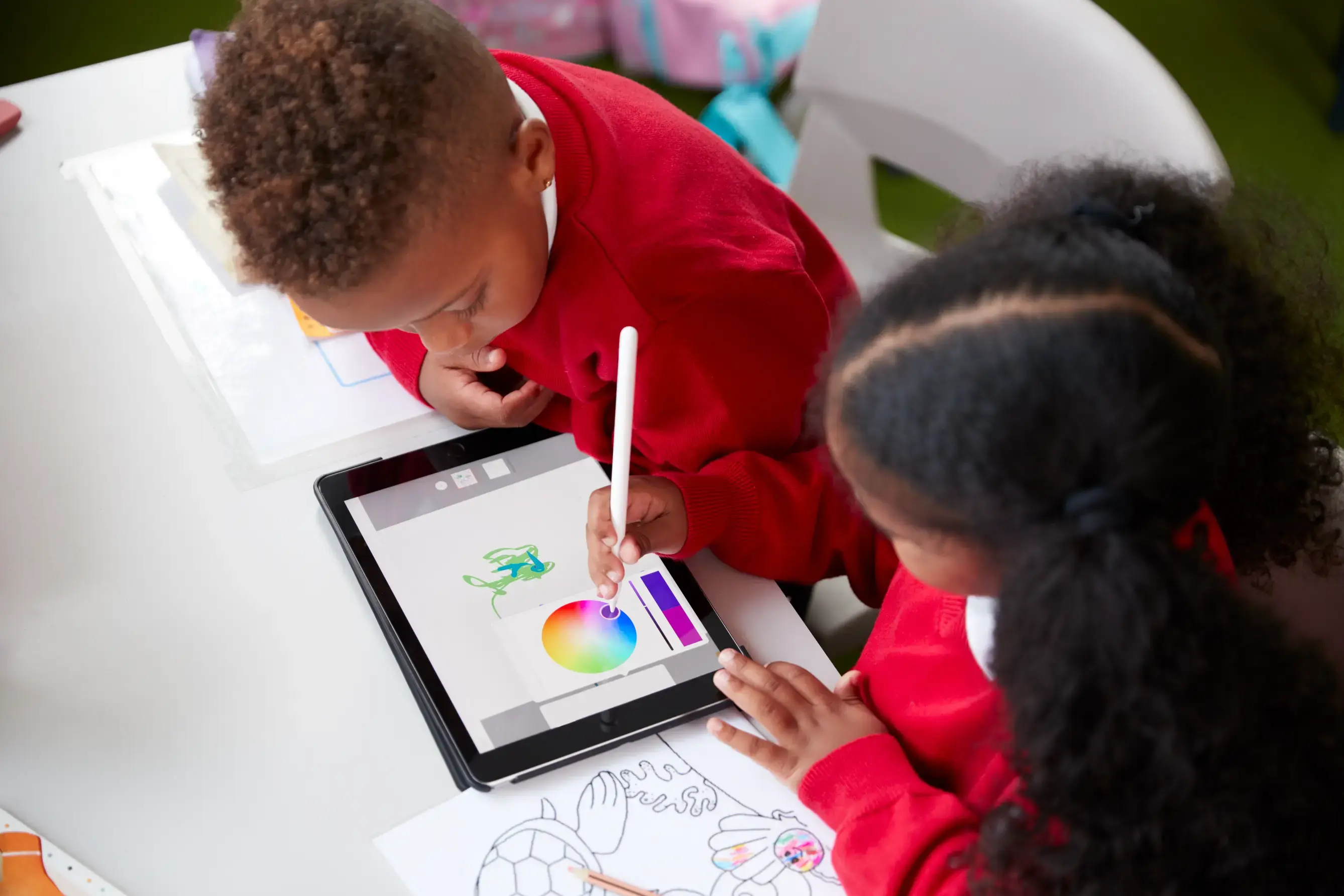 Young children using an ipad device in school