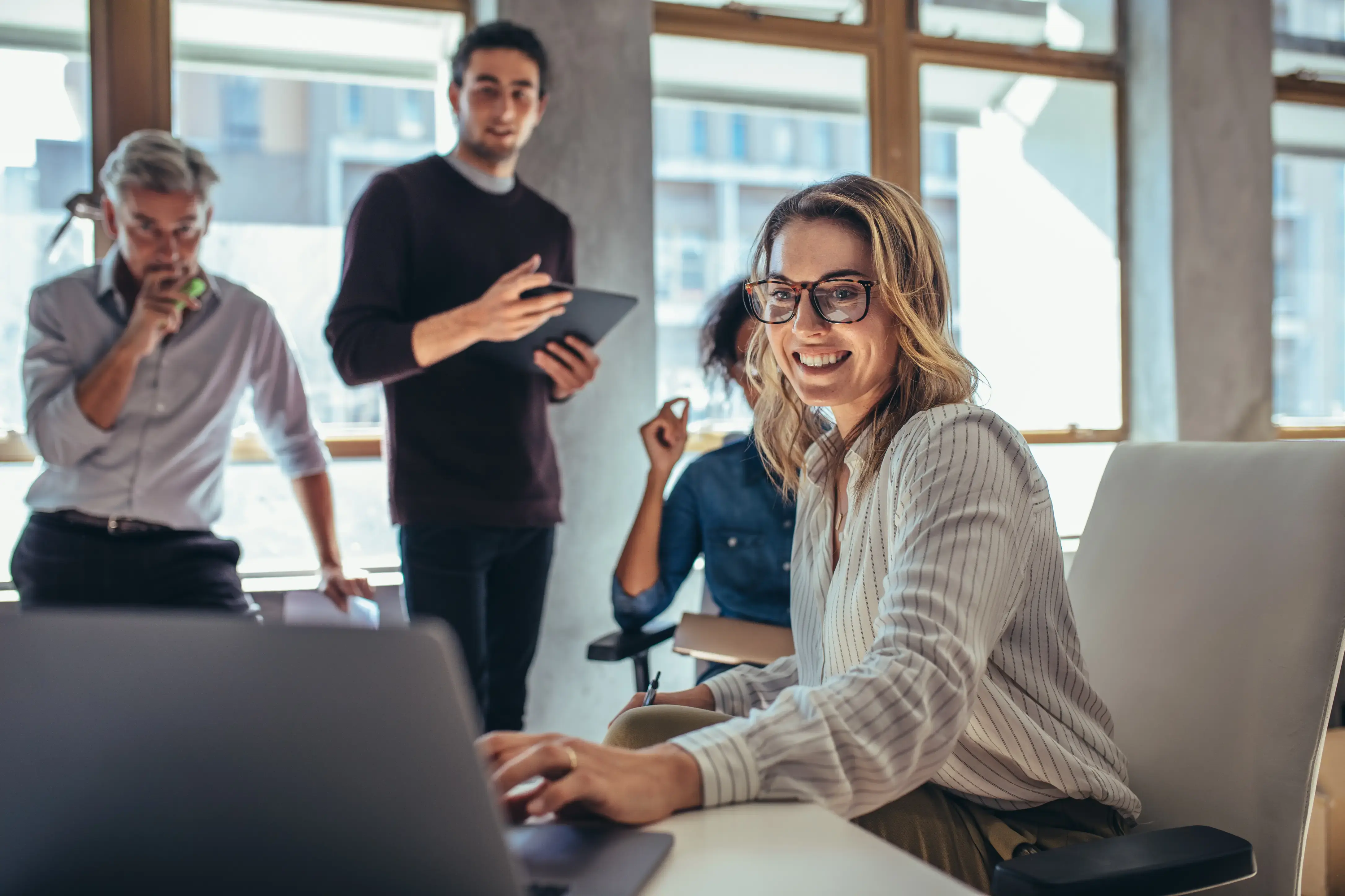 business team using a laptop during a meeting