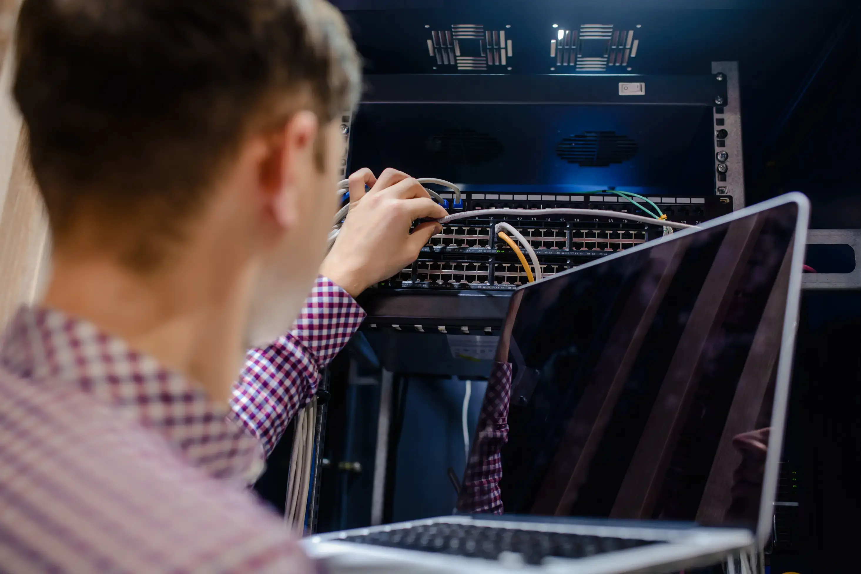 technician connecting the internet network cable